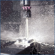 Rinse workpieces and fixtures by using internal coolant with the spindle stopped